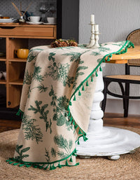 Mantel redondo con borlas y estampado de ramas de pino verde