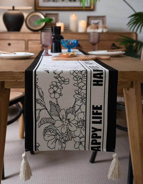 Drapeau de table à pompons avec lettres florales noires et blanches