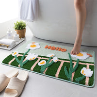 Tapis de bain floqué à motif marguerites