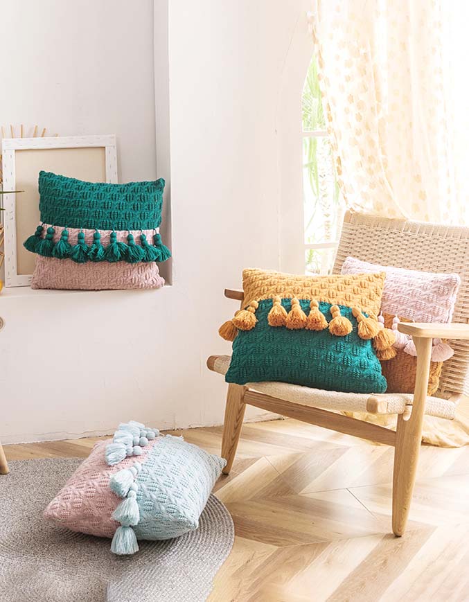 Housse de coussin à pompons en tricot de style ethnique