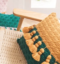 Housse de coussin à pompons en tricot de style ethnique