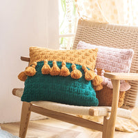 Housse de coussin à pompons en tricot de style ethnique