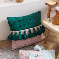 Housse de coussin à pompons en tricot de style ethnique