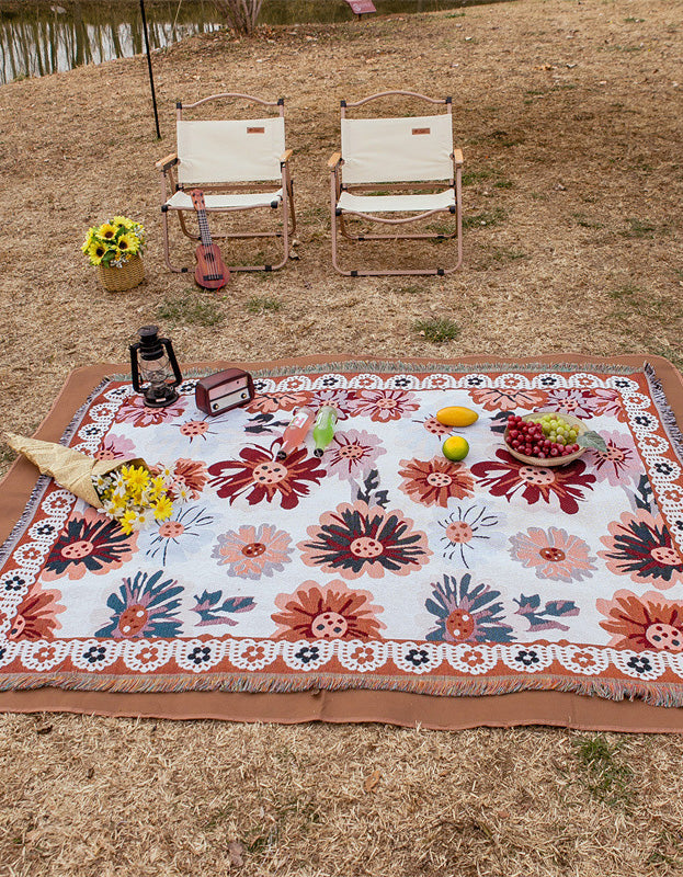 Couverture de pique-nique à pompons et motif floral pastoral